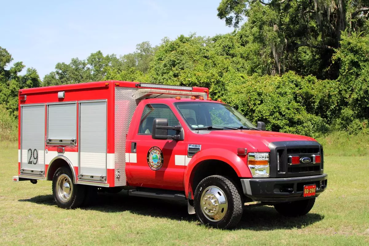 red truck with white stripe and high springs fire department logo on door