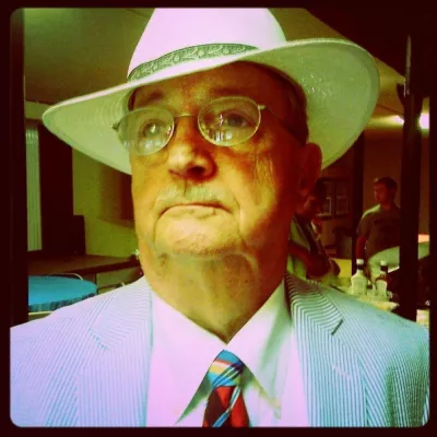 image of mayor Dean Davis wearing a blue suit, tie and white hat.
