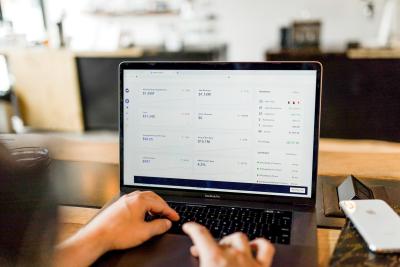 austin-distel-744ogeqpxpq-unsplash_1.jpg Laptop screen showing charts
