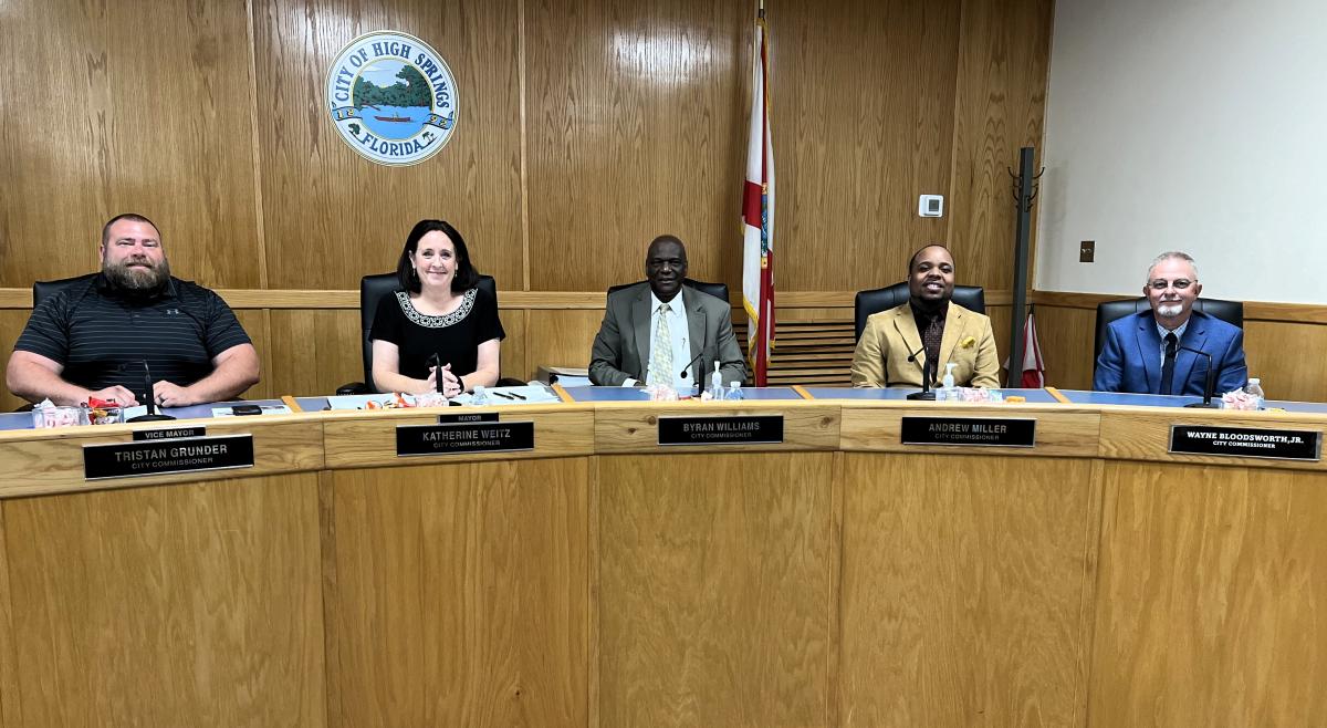 photo of commission sitting at dais